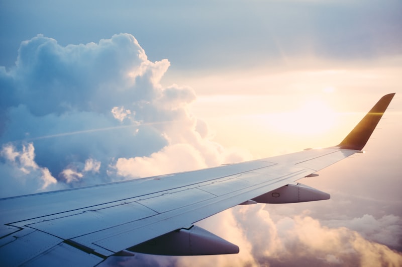View of an airplane wing from a window seat, mid-flight