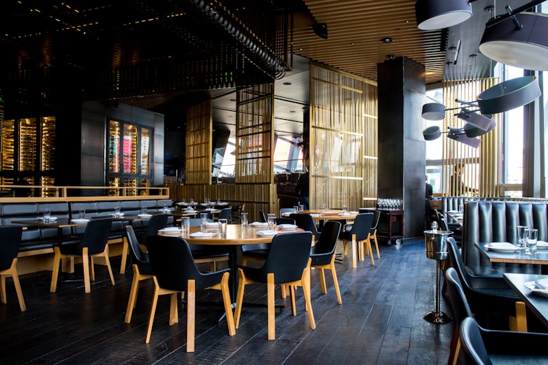 A restaurant dining room set for service